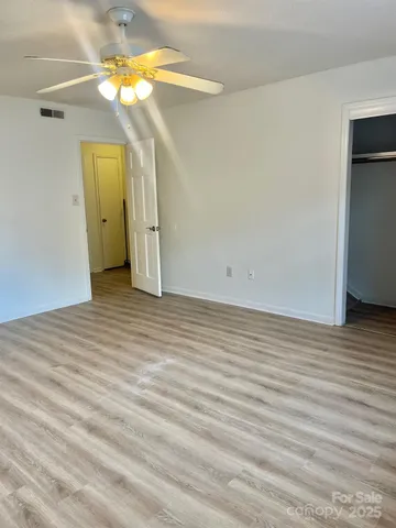 a view of a livingroom with wooden floor