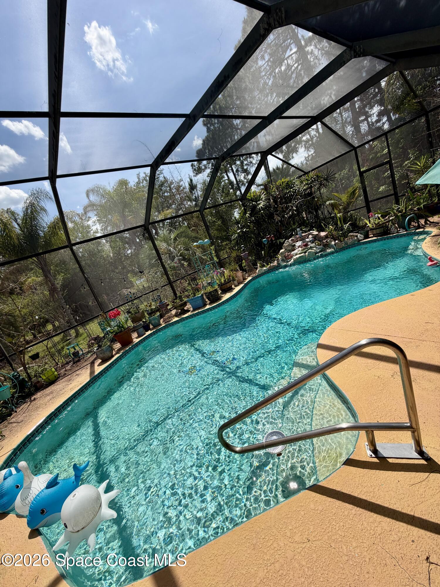 3535 Sparrow Hawk Trail Mims, FL 32754 - Photo 2 of 2 a view of a backyard