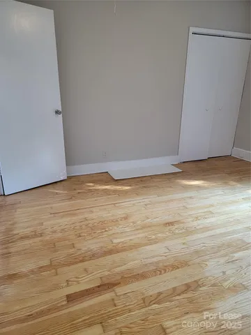 a view of room and wooden floor