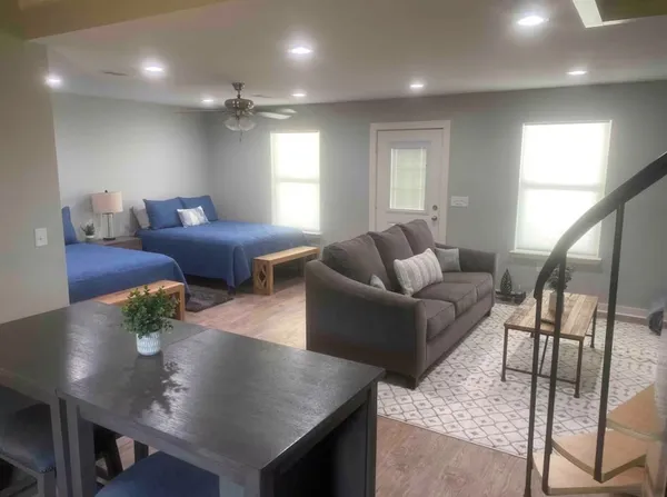a living room with furniture and a large window