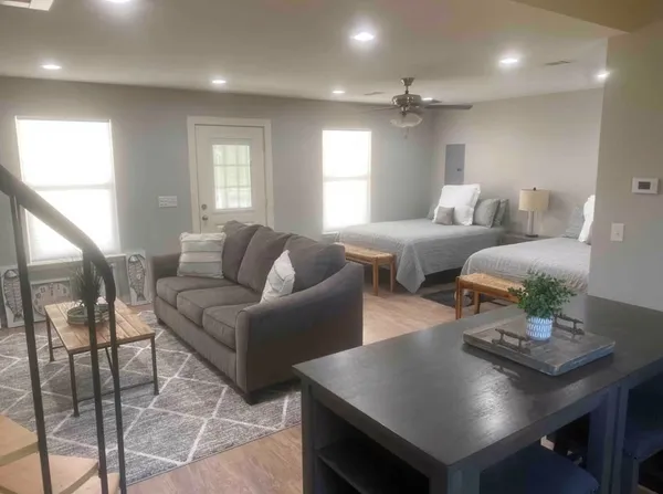 a living room with furniture and a large window