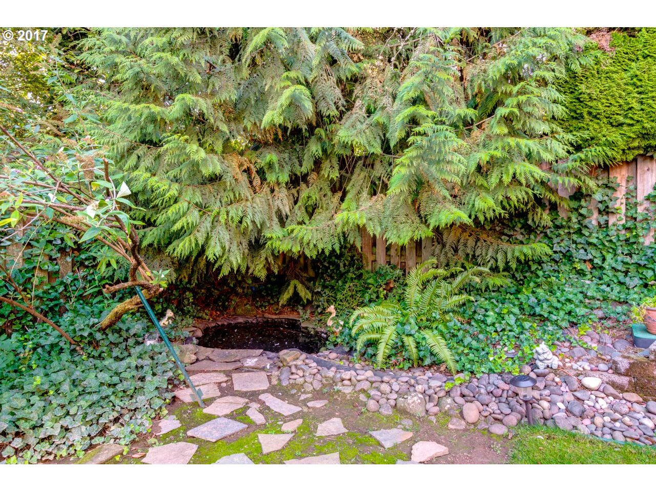 18420 Southwest Colfelt Lane Sherwood, OR 97140 - Photo 25 of 32 a view of a garden with a tree
