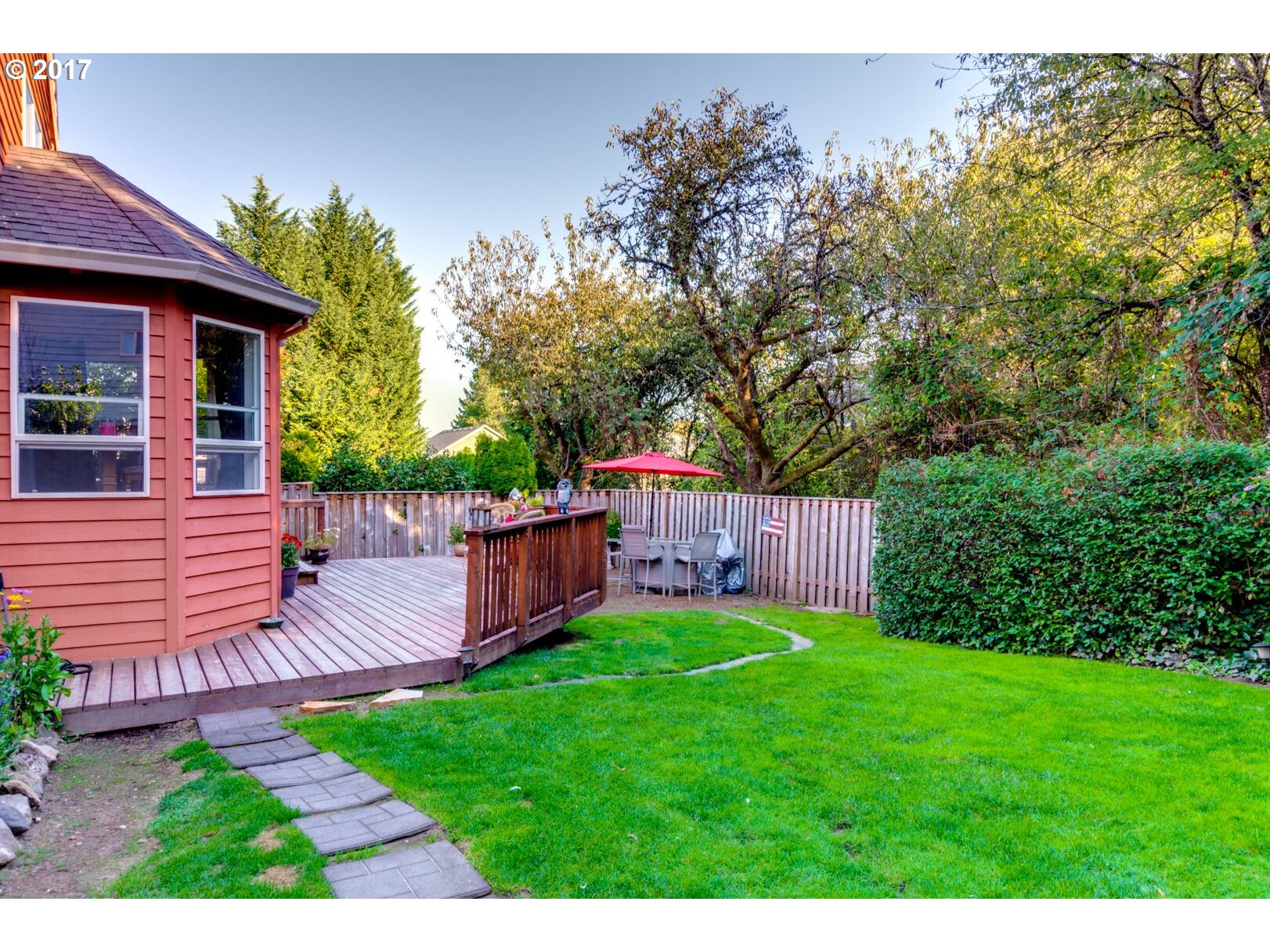 18420 Southwest Colfelt Lane Sherwood, OR 97140 - Photo 26 of 32 a view of a backyard with plants and a patio