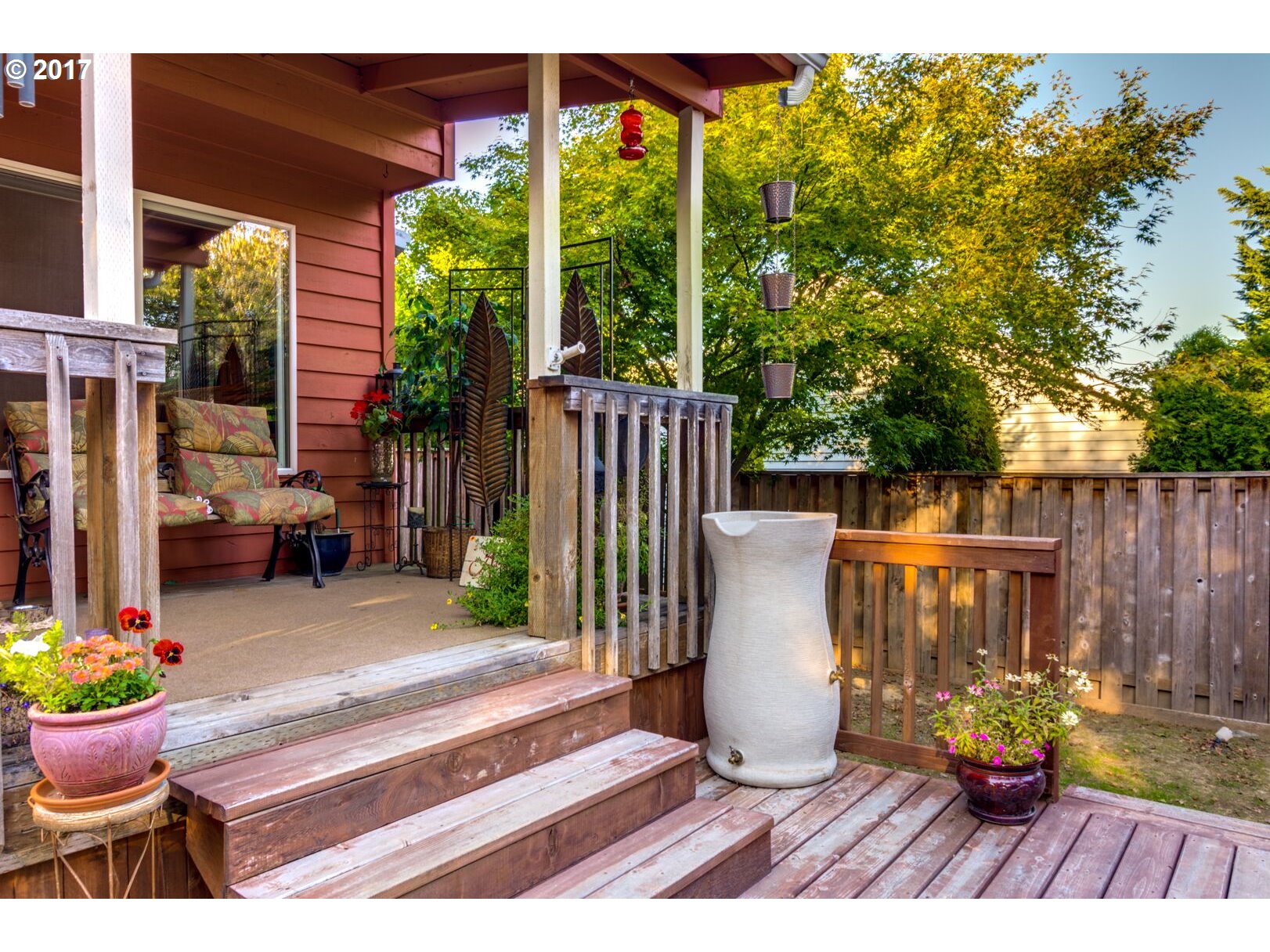 18420 Southwest Colfelt Lane Sherwood, OR 97140 - Photo 30 of 32 a view of a patio with couches table and chairs and potted plants