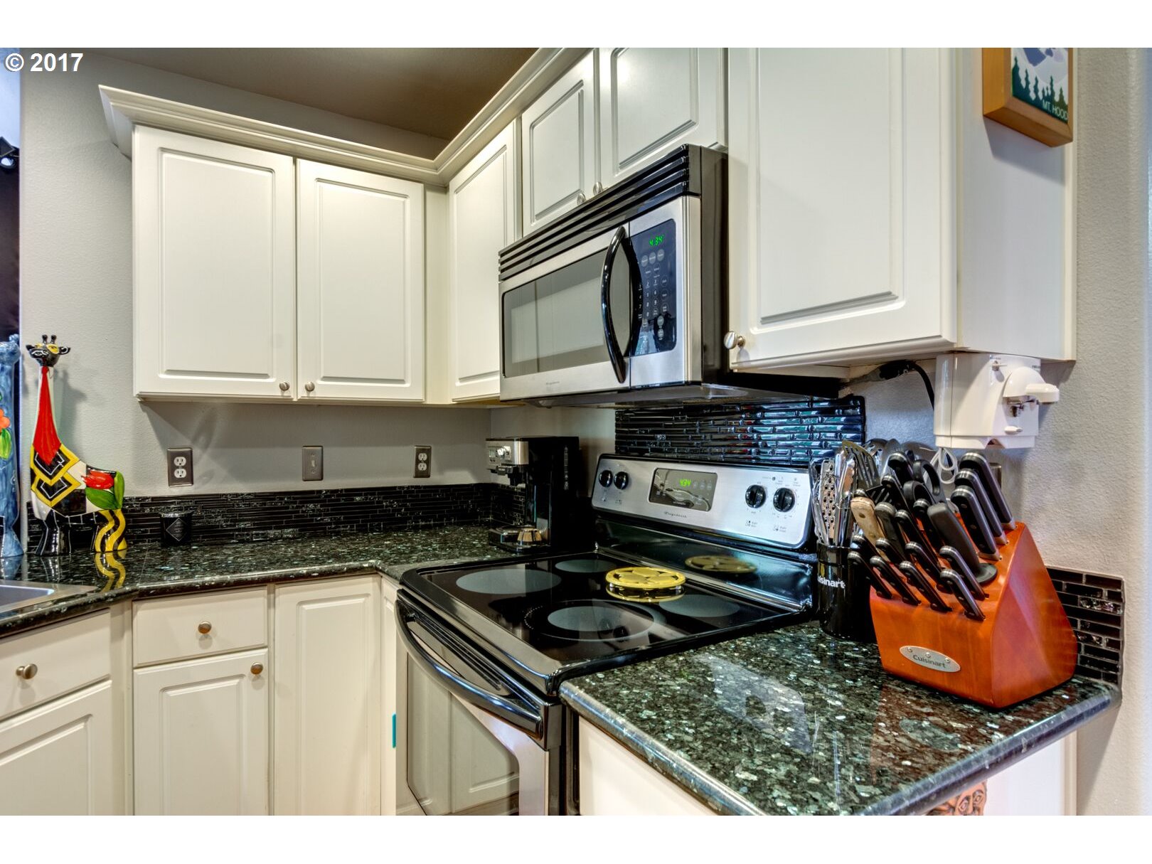 18420 Southwest Colfelt Lane Sherwood, OR 97140 - Photo 4 of 32 a kitchen with stainless steel appliances granite countertop a stove a sink and a microwave