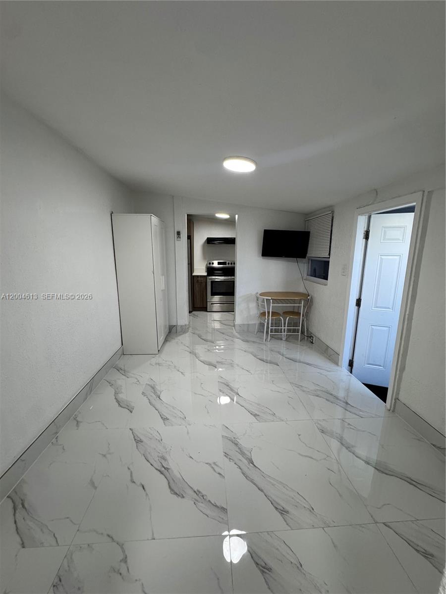 a view of a livingroom with furniture and furniture