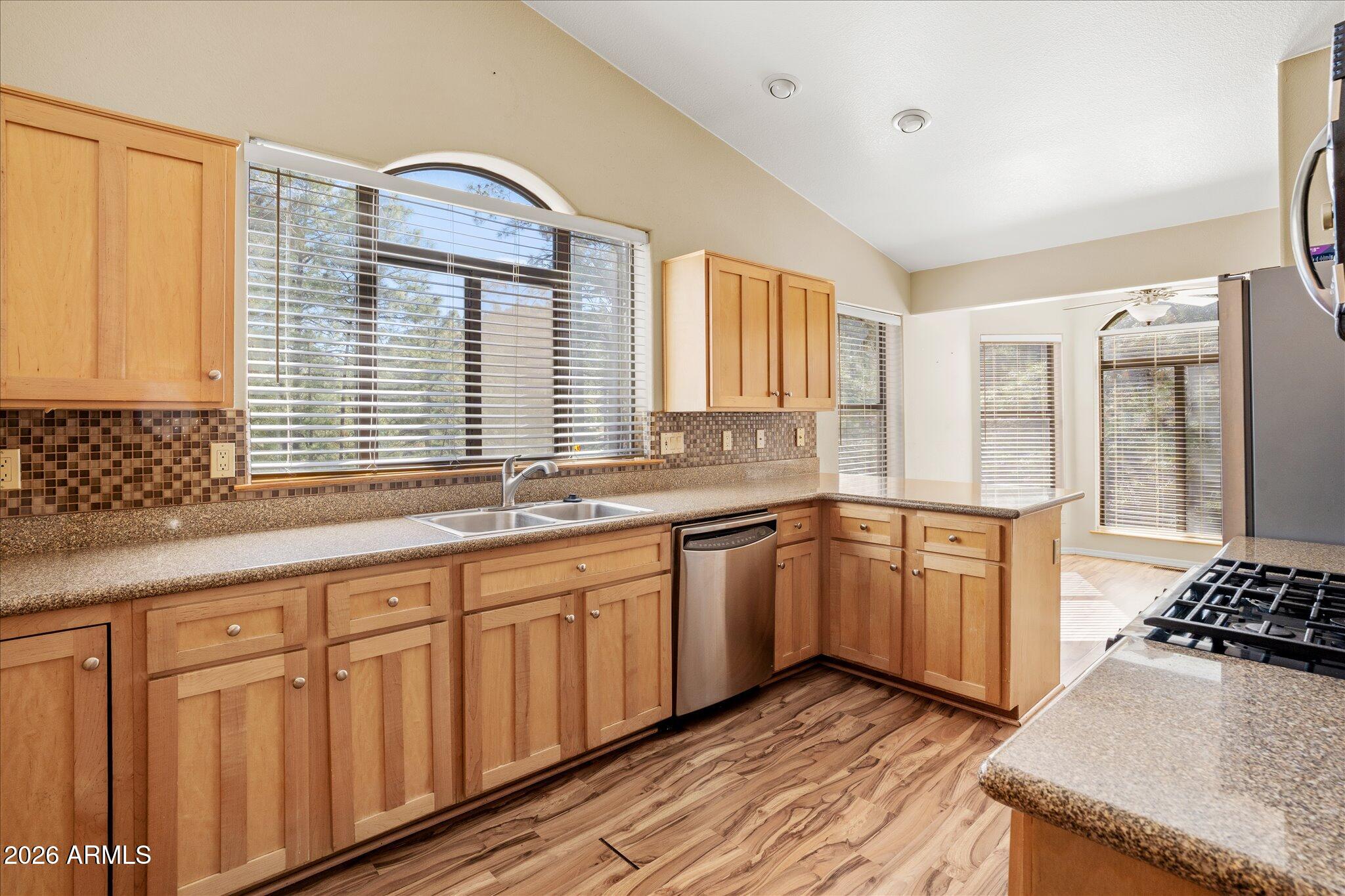 1466 East Valley View Road Prescott, AZ 86303 - Photo 13 of 31 a kitchen with granite countertop a sink and a stove