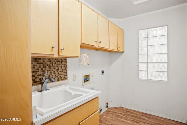 a bathroom with a sink and a window