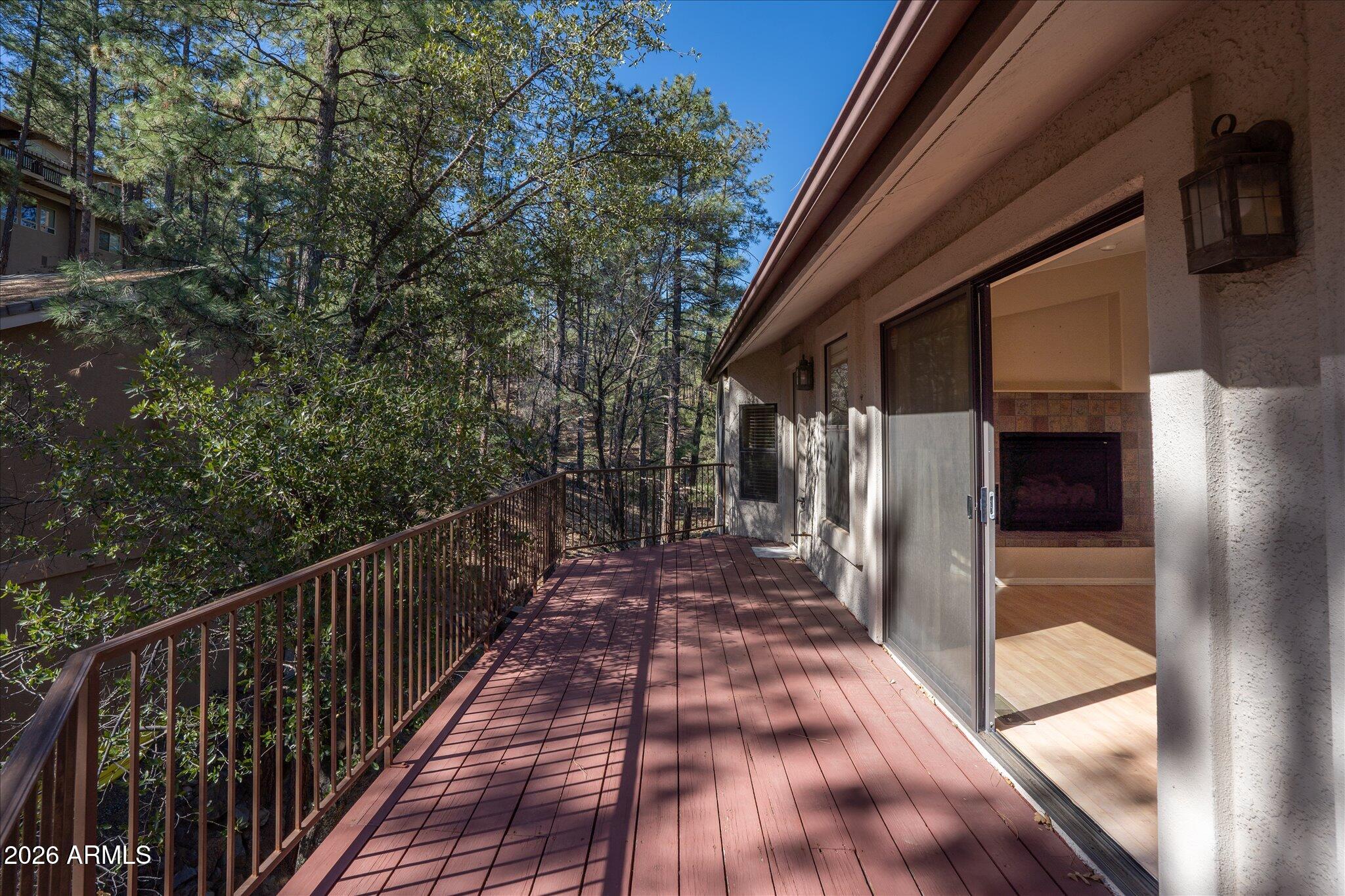 1466 East Valley View Road Prescott, AZ 86303 - Photo 17 of 31 a view of a balcony with wooden floor and fence