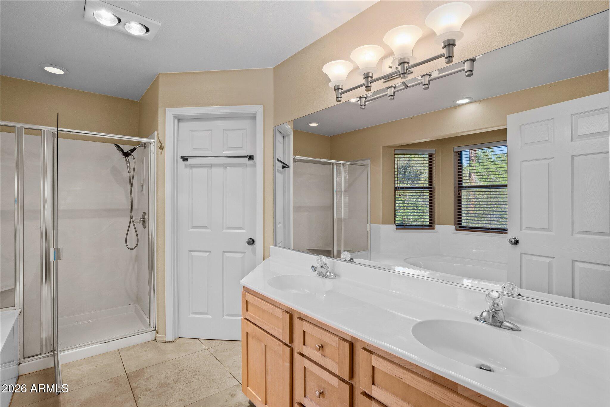 1466 East Valley View Road Prescott, AZ 86303 - Photo 21 of 31 a bathroom with a double vanity sink mirror and shower