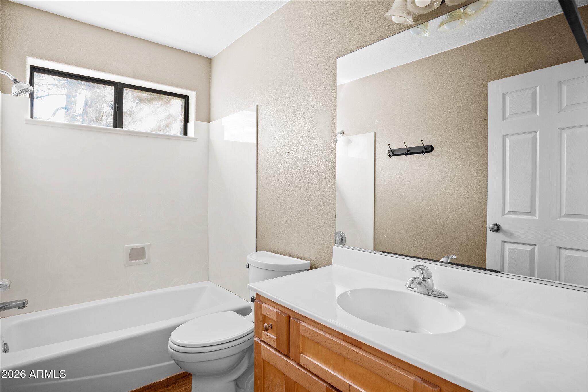 1466 East Valley View Road Prescott, AZ 86303 - Photo 23 of 31 a bathroom with a sink toilet and shower