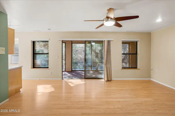 a view of an empty room with glass door