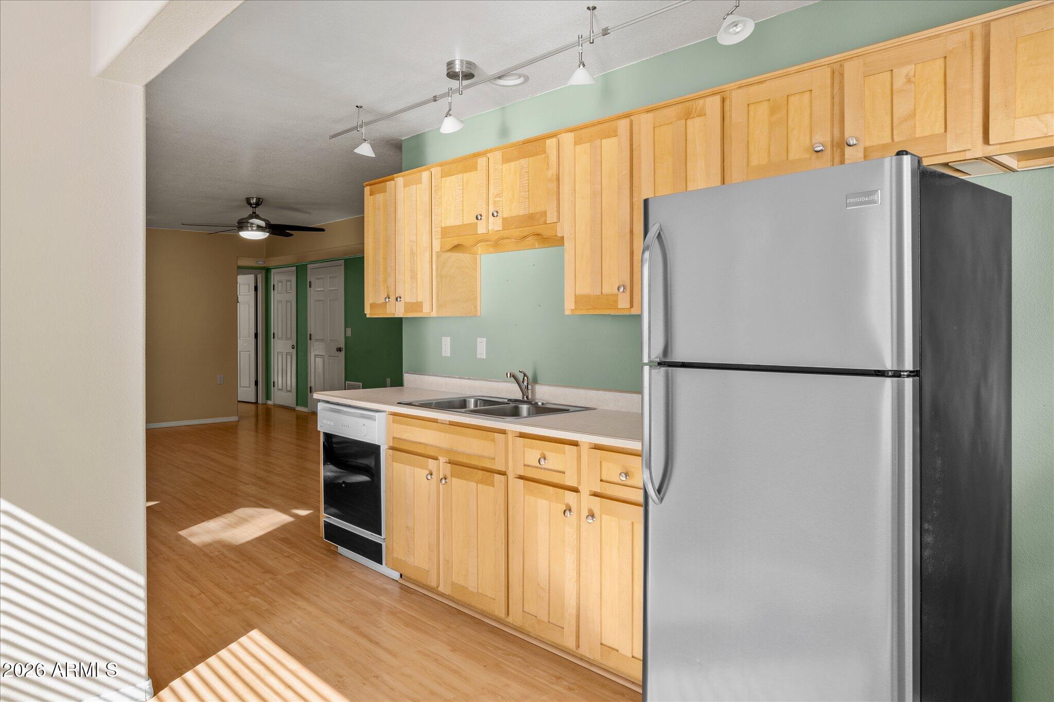 1466 East Valley View Road Prescott, AZ 86303 - Photo 28 of 31 a kitchen with a refrigerator and a sink