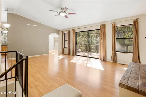 a view of an empty room with glass door