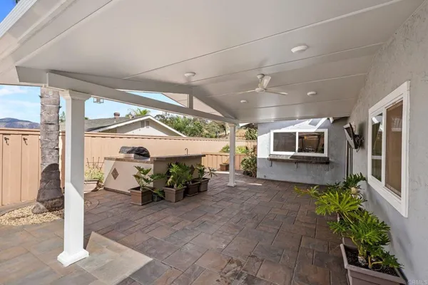 a lobby with furniture and a potted plant