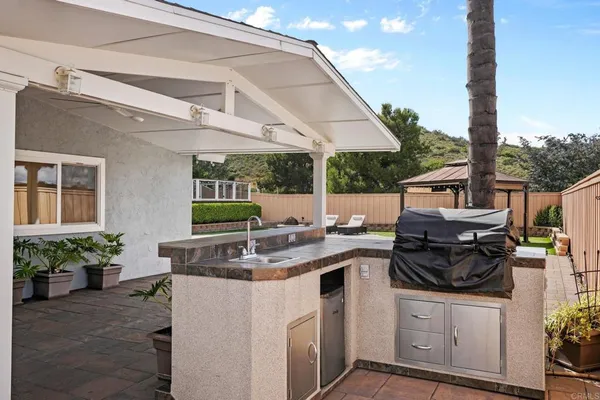 a kitchen with a stove and a sink