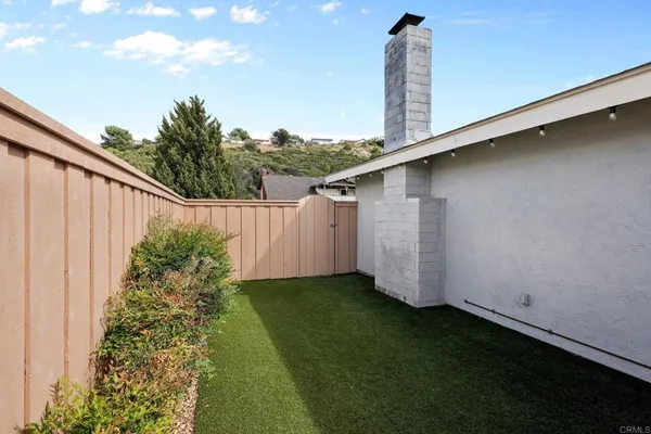 a backyard of a house with lots of green space