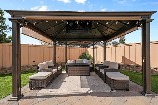 a patio view with couches and chairs