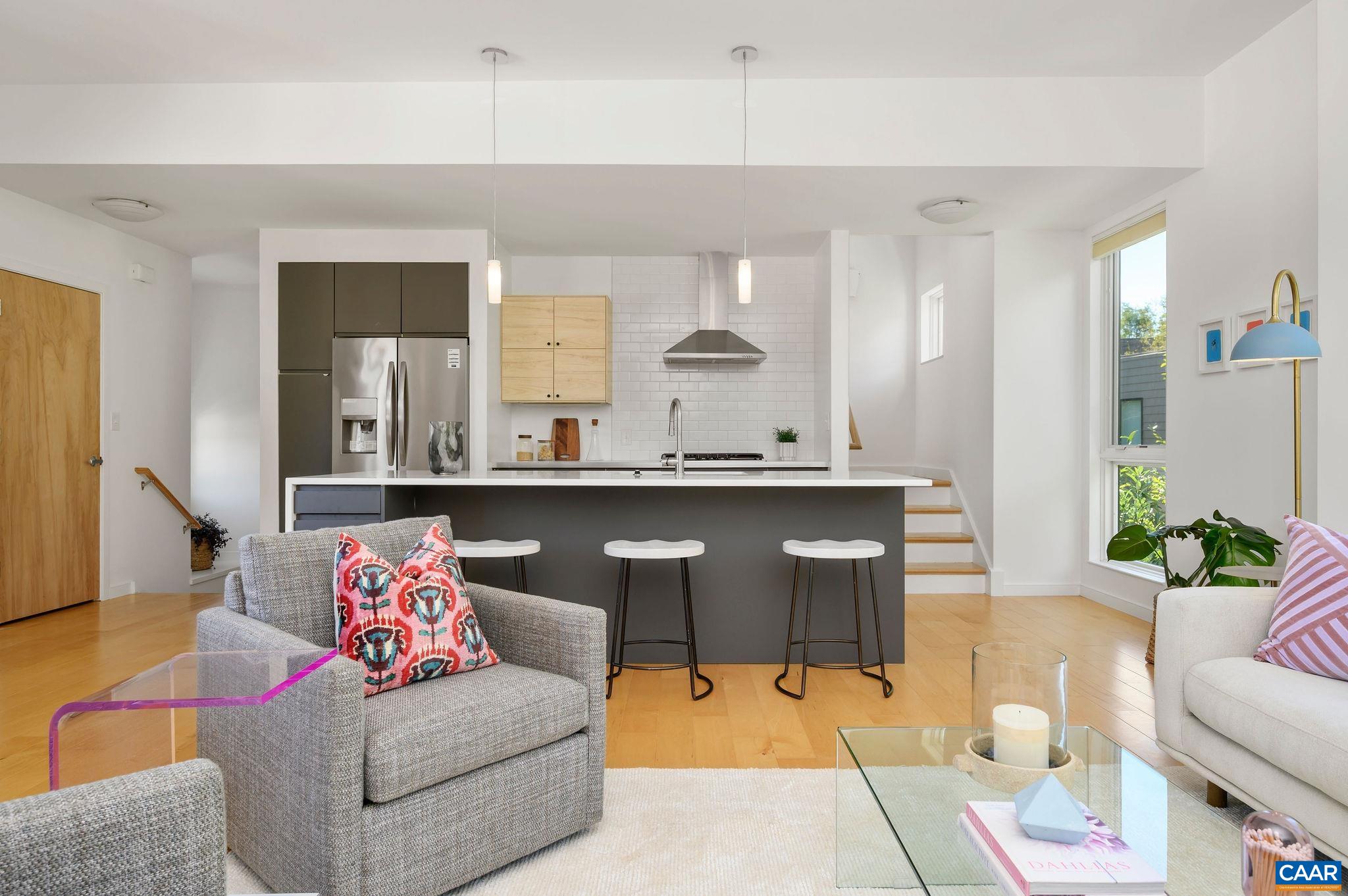 1130 East High Street, Unit J Charlottesville, VA 22902 - Photo 11 of 42 a living room with furniture and view of kitchen