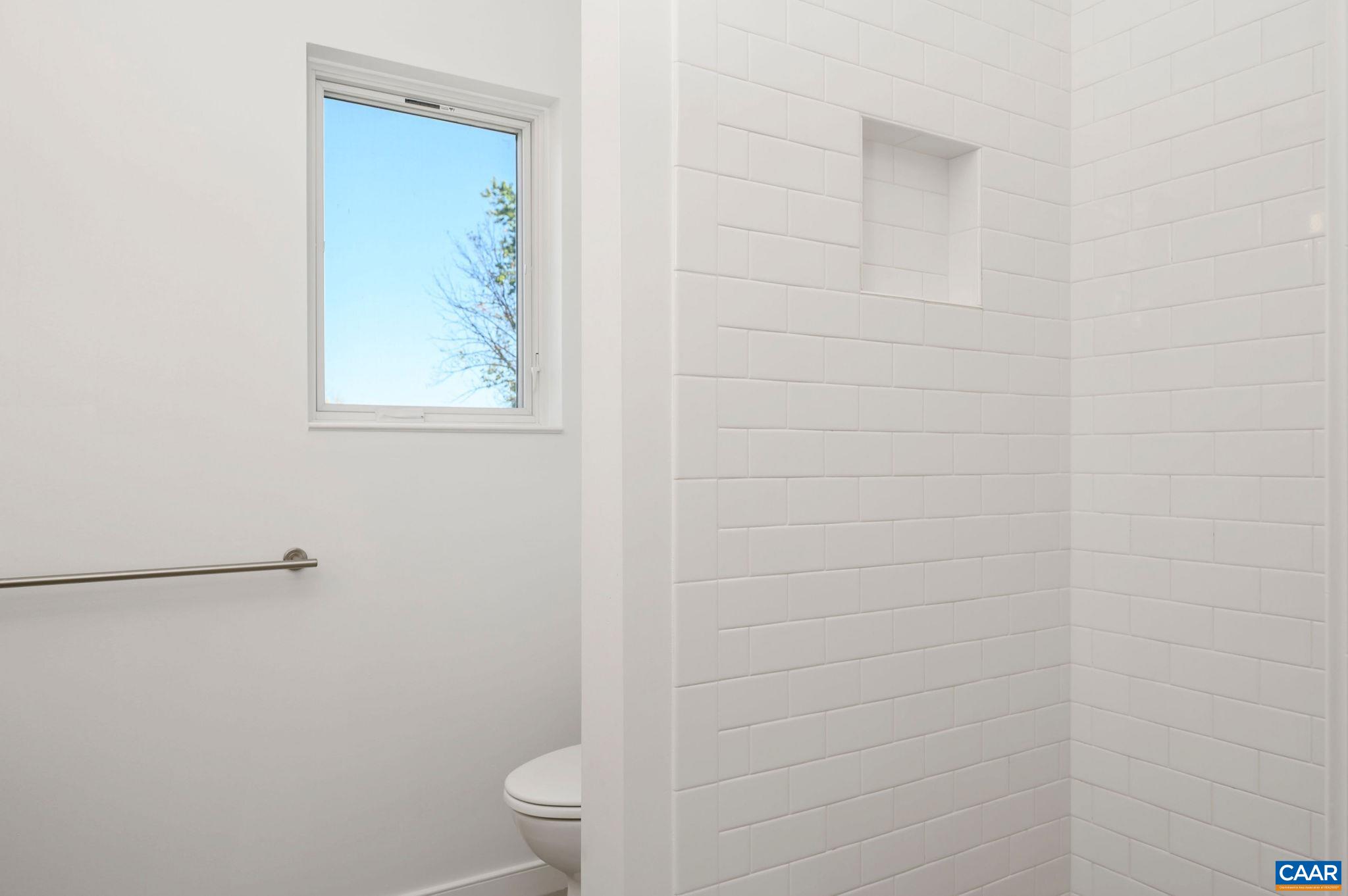 1130 East High Street, Unit J Charlottesville, VA 22902 - Photo 17 of 42 a bathroom with a toilet