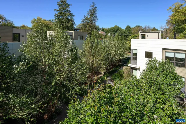 a backyard of a house with lots of green space