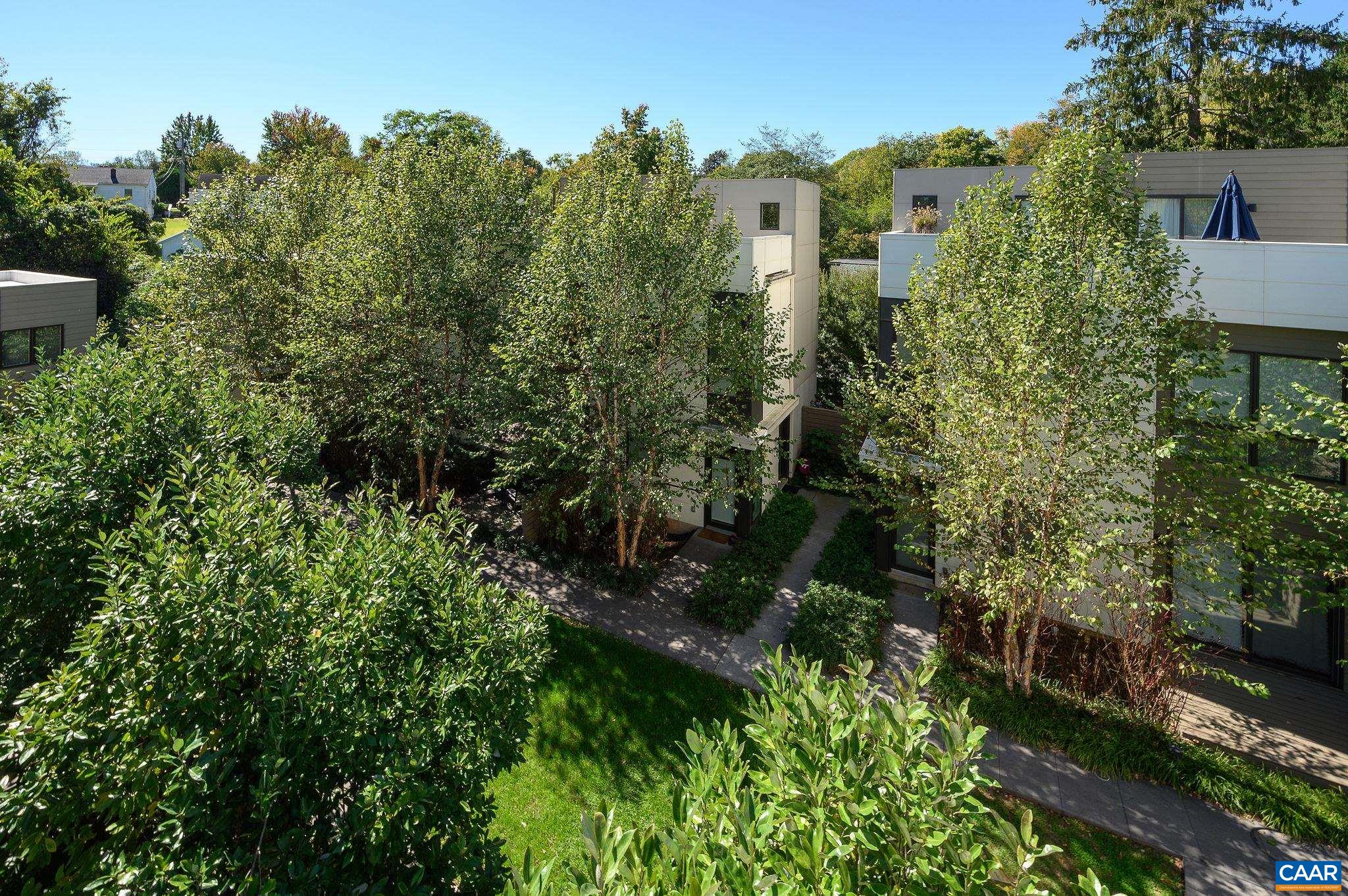 1130 East High Street, Unit J Charlottesville, VA 22902 - Photo 30 of 42 an aerial view of a house with a yard