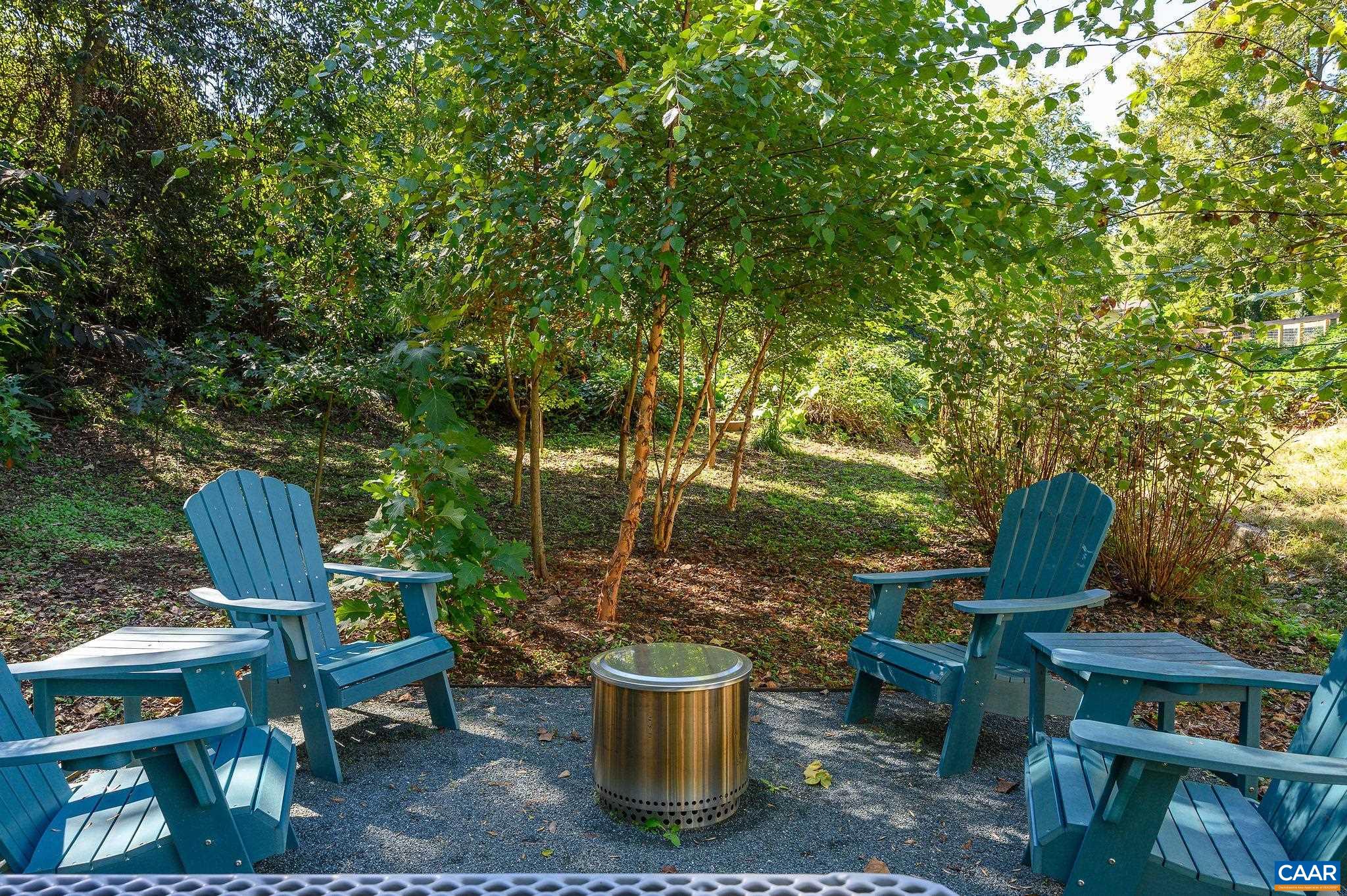 1130 East High Street, Unit J Charlottesville, VA 22902 - Photo 33 of 42 a view of a backyard with sitting area and garden