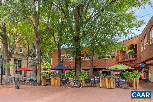 a city street lined with buildings and trees