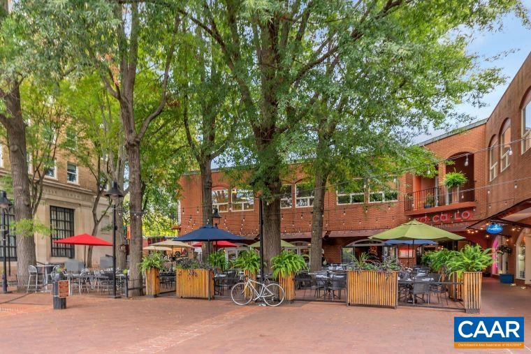 1130 East High Street, Unit J Charlottesville, VA 22902 - Photo 38 of 42 a street sign under an umbrella