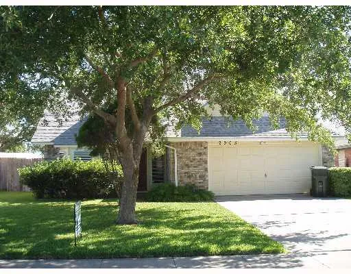 a house with trees in front of it