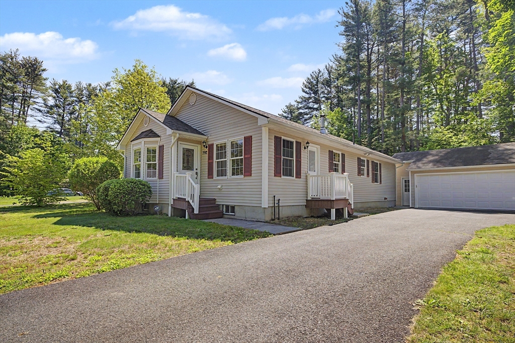 792 Ryan Road Northampton, MA 01062 - Photo 3 of 29 a front view of a house with a yard and garage