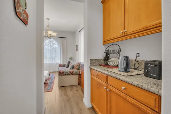 a kitchen with sink and cabinets