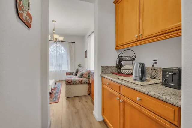 a kitchen with sink and cabinets