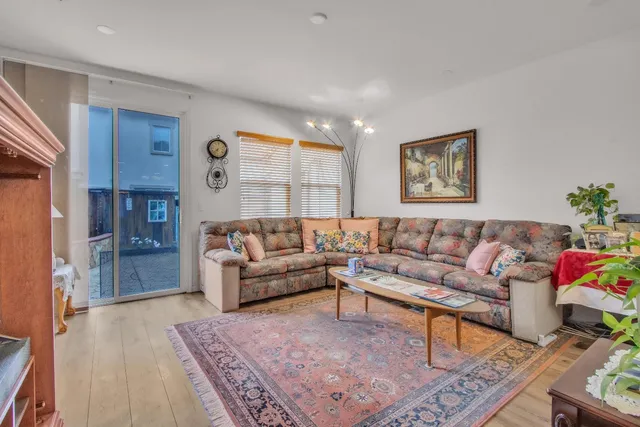 a living room with furniture and a rug