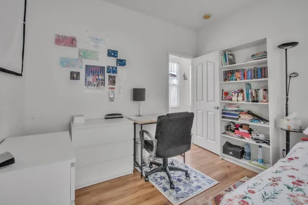 a workspace with furniture and book shelf