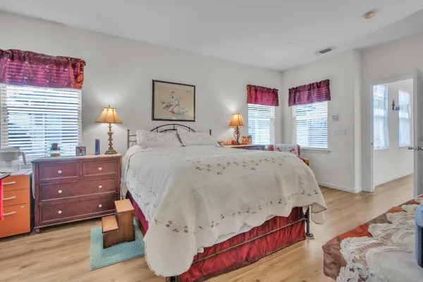 a bed room with a bed and a dresser