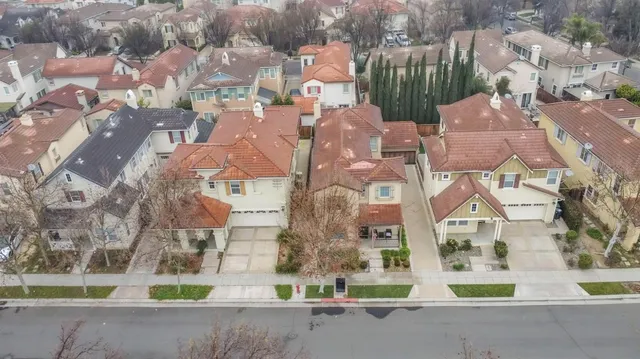 an aerial view of residential houses with outdoor space