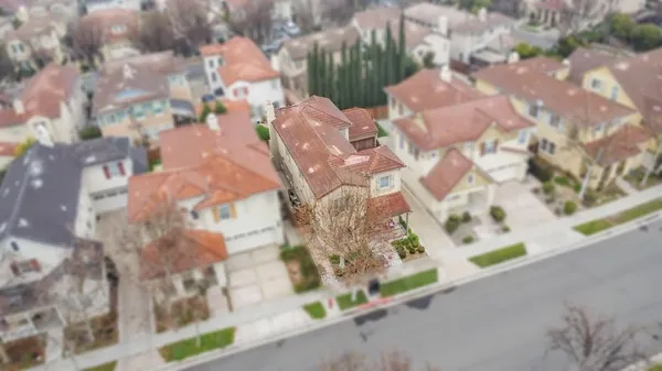 an aerial view of residential houses with outdoor space
