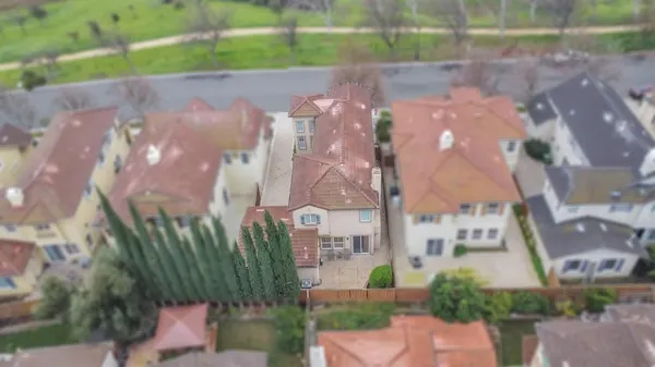 an aerial view of houses with outdoor space
