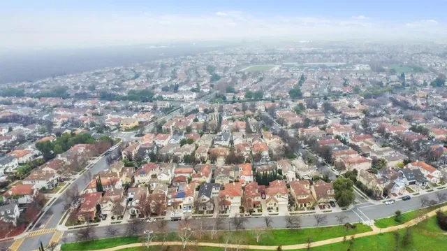 an aerial view of a house with a yard