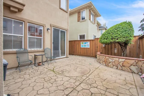 a view of a house with a yard and sitting space