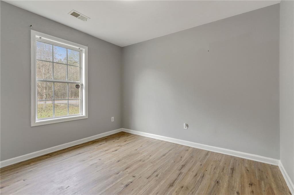 54 Taylorsville Road Aragon, GA 30104 - Photo 17 of 20 an empty room with wooden floor and windows