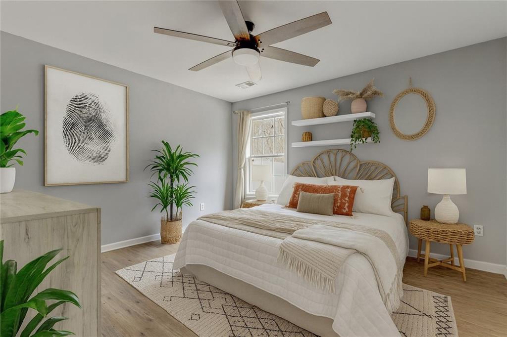 54 Taylorsville Road Aragon, GA 30104 - Photo 4 of 20 a bedroom with bed and a potted plant