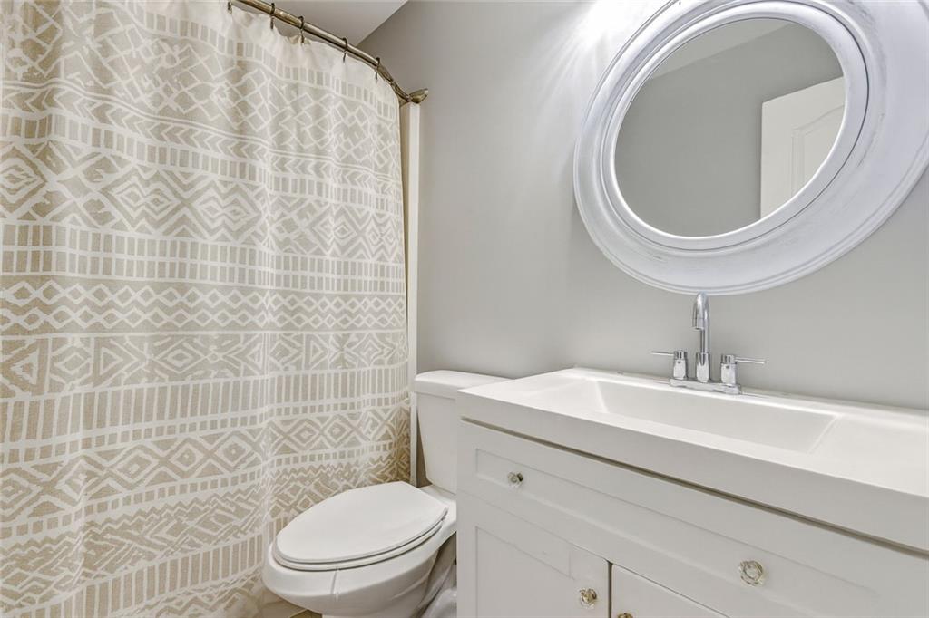 54 Taylorsville Road Aragon, GA 30104 - Photo 5 of 20 a bathroom with a sink a toilet and a mirror