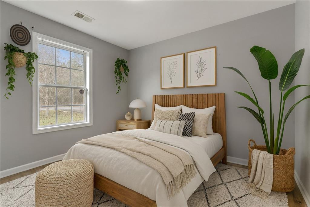 54 Taylorsville Road Aragon, GA 30104 - Photo 6 of 20 a bedroom with bed and a potted plant