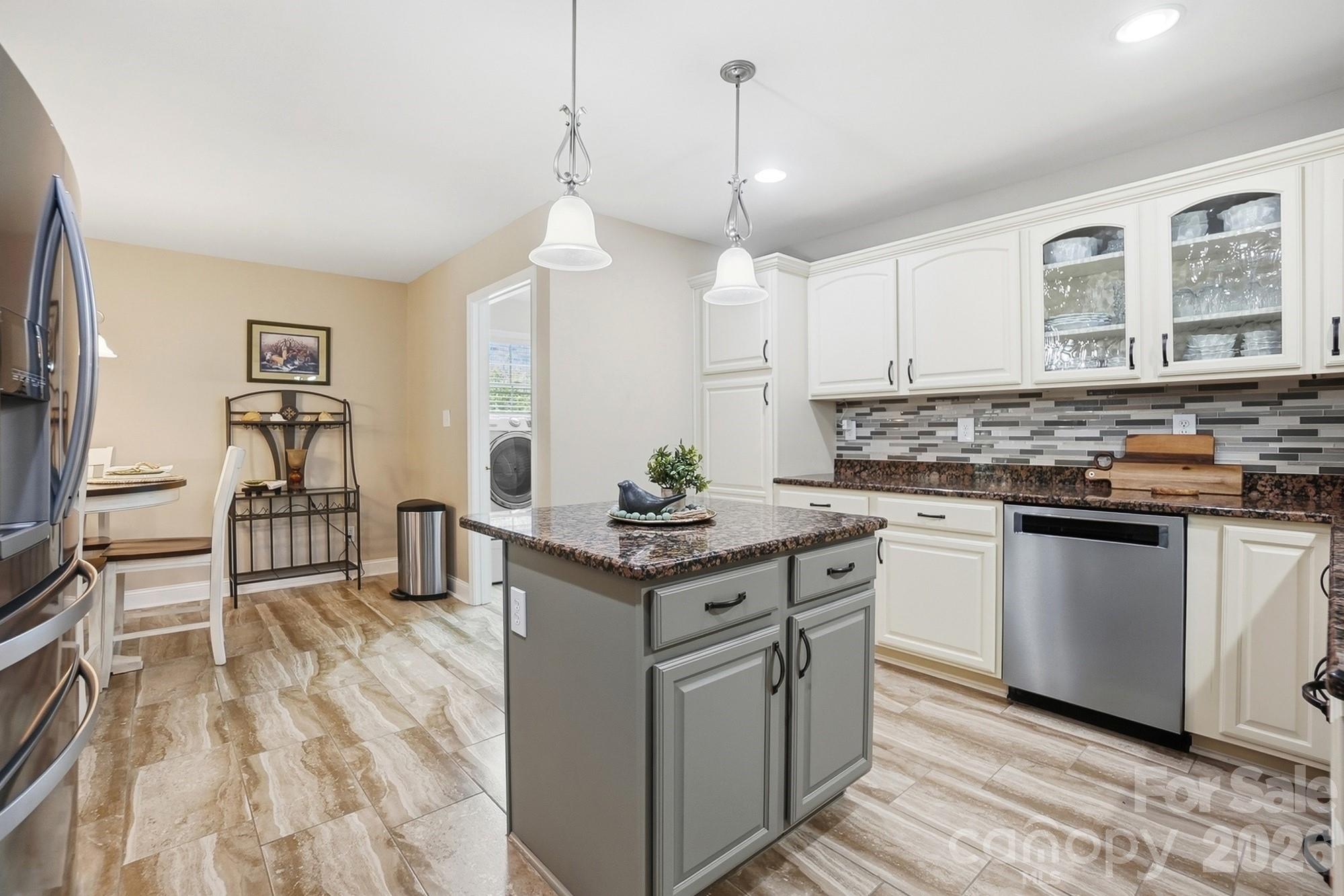 3324 Muddy Creek Road Midland, NC 28107 - Photo 15 of 46 a kitchen with stainless steel appliances granite countertop a stove and a sink