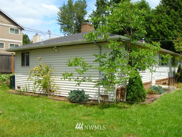 9618 Renton Avenue South Seattle, WA 98118 - Photo 2 of 7 a view of a house with a yard