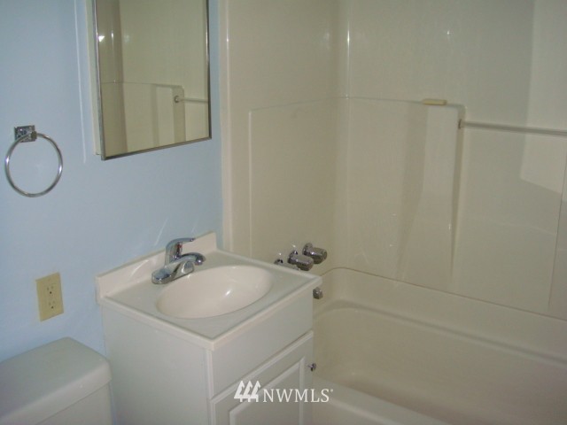 9618 Renton Avenue South Seattle, WA 98118 - Photo 6 of 7 a bathroom with a sink and a mirror
