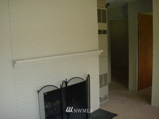 9618 Renton Avenue South Seattle, WA 98118 - Photo 7 of 7 a close view of shoes stand in kitchen