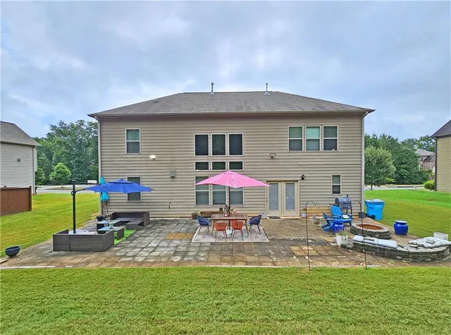 a front view of house with yard and outdoor seating